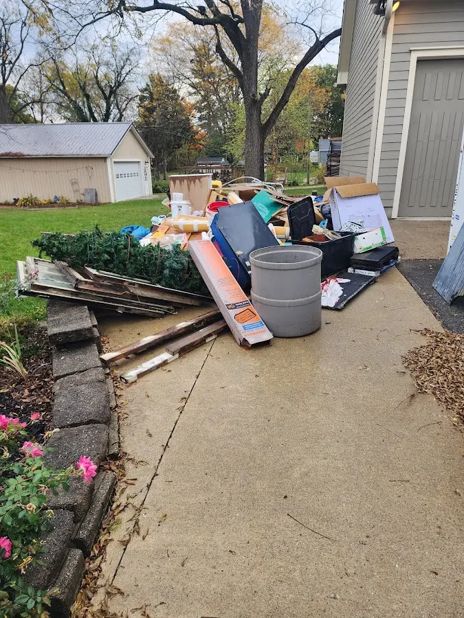 Dumpster being loaded with debris for Commercial Dumpster Rental in Kendall